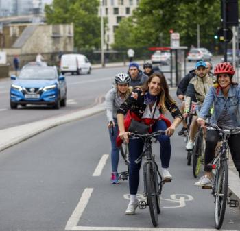 People riding bikes in a cycle lane - Zero Emissions Network