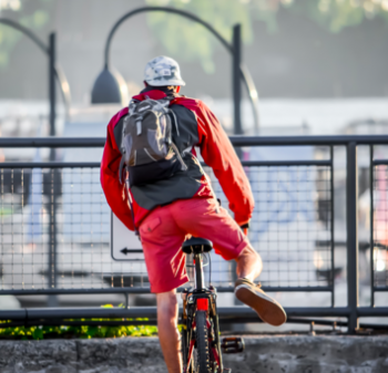 Man With Backpack Learning to Cycle - Zero Emissions Network