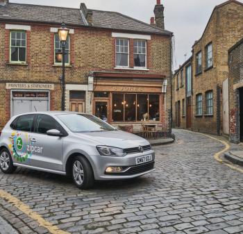 Zip car on cobbled street